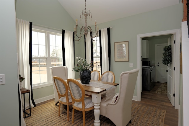 dining room with a notable chandelier, plenty of natural light, lofted ceiling, and wood finished floors