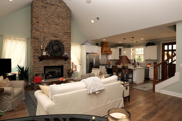 living room with visible vents, dark wood-style floors, recessed lighting, a fireplace, and crown molding