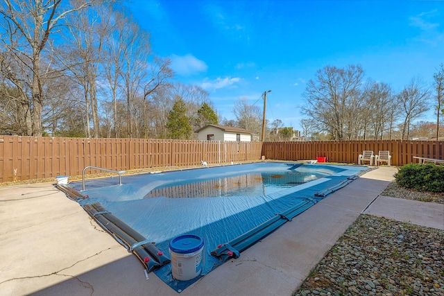 view of pool with a patio area, a fenced in pool, and a fenced backyard