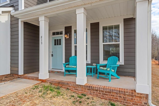 property entrance with covered porch