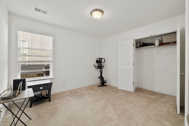 office area with visible vents, baseboards, and carpet floors