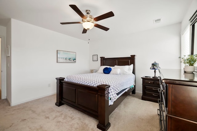 bedroom with visible vents, light carpet, baseboards, and a ceiling fan