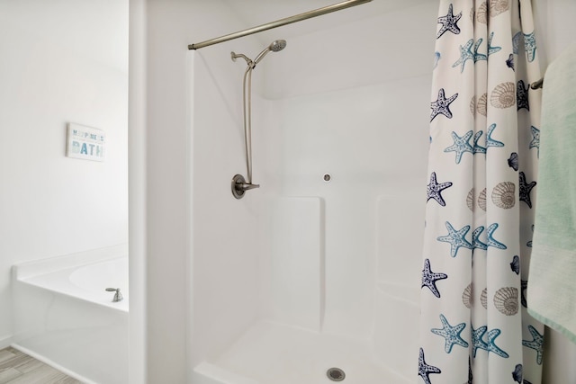 bathroom with a shower stall