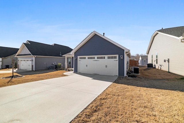 view of front of house with concrete driveway and cooling unit