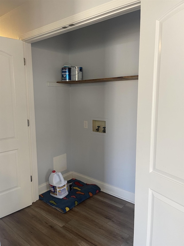 washroom featuring laundry area, hookup for a washing machine, baseboards, and wood finished floors