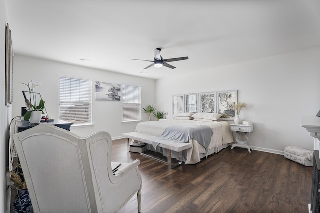 bedroom with visible vents, baseboards, ceiling fan, and dark wood-style flooring