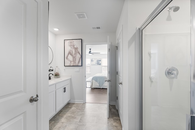 ensuite bathroom with visible vents and a shower stall