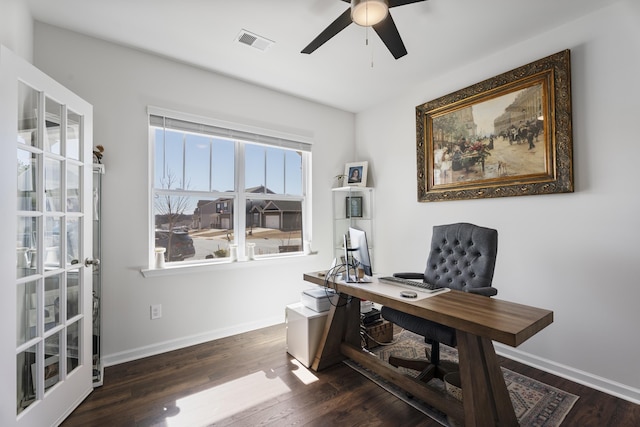 office area with baseboards, wood finished floors, visible vents, and ceiling fan