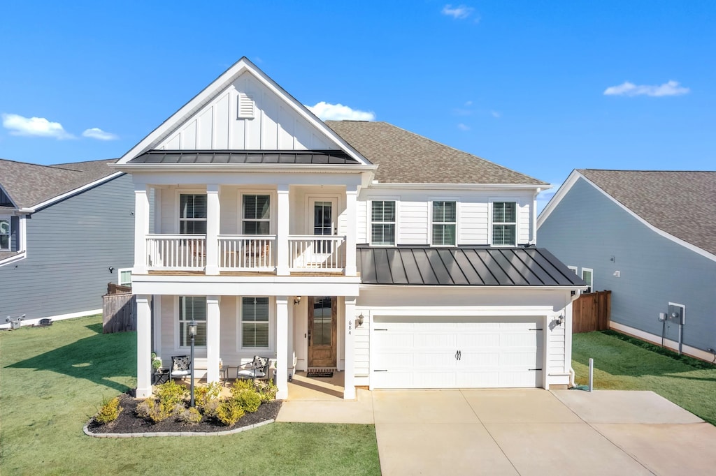 view of front of house featuring metal roof, board and batten siding, and a standing seam roof