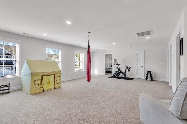 workout room featuring recessed lighting, visible vents, light colored carpet, and baseboards