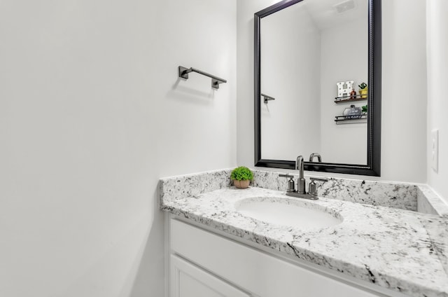 bathroom featuring visible vents and vanity