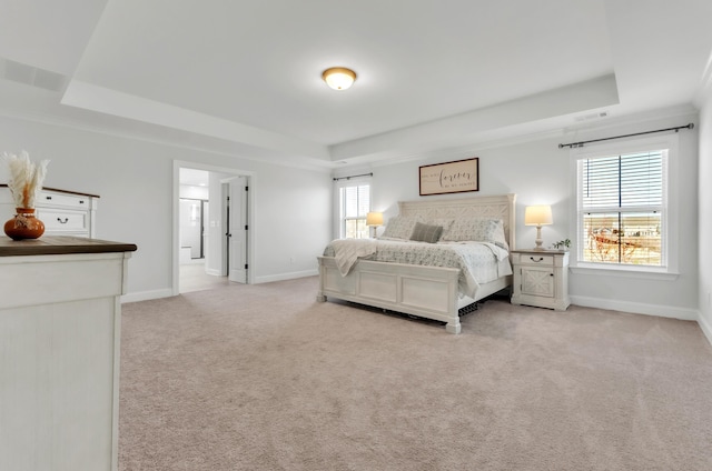 bedroom featuring baseboards, a raised ceiling, visible vents, and carpet flooring