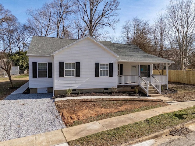 single story home featuring crawl space, covered porch, roof with shingles, and fence