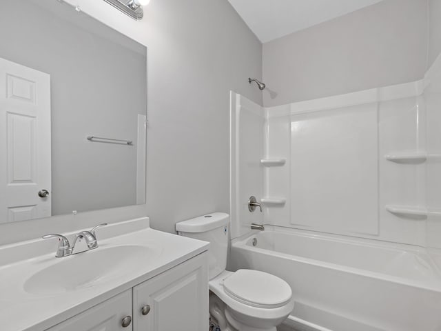 bathroom with shower / tub combination, toilet, and vanity