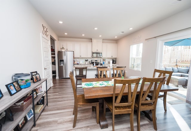 dining area with recessed lighting and light wood-type flooring