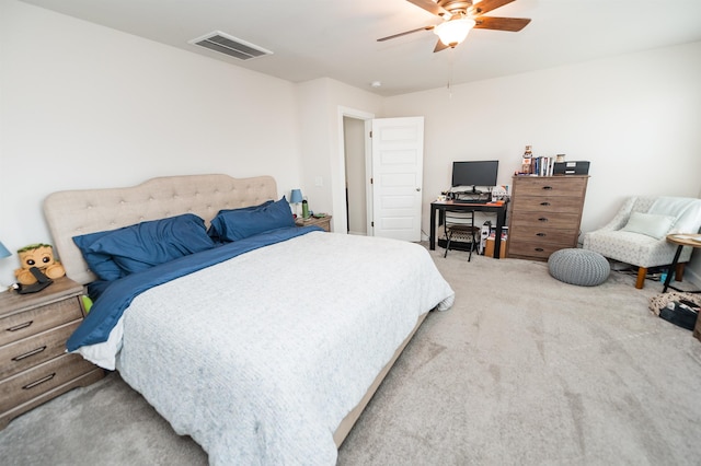 carpeted bedroom featuring visible vents and ceiling fan