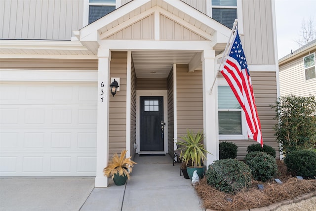 property entrance featuring board and batten siding