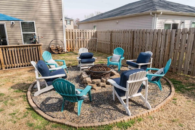 view of yard with a fire pit and a fenced backyard