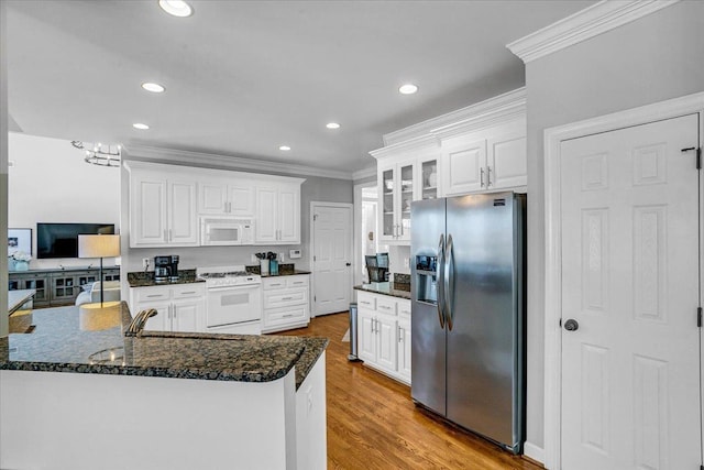 kitchen with white appliances, white cabinets, wood finished floors, and glass insert cabinets