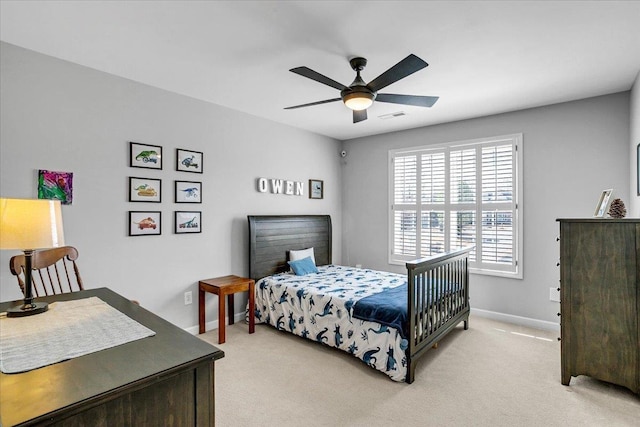 bedroom featuring visible vents, light carpet, baseboards, and ceiling fan