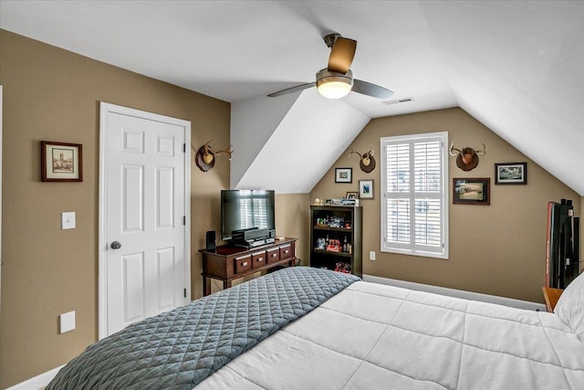 bedroom with visible vents, a ceiling fan, and lofted ceiling