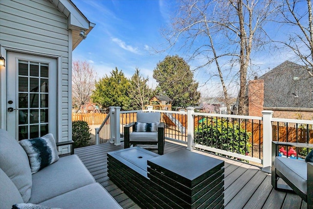 wooden deck featuring outdoor lounge area