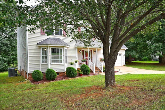 traditional home featuring roof with shingles, an attached garage, a front lawn, concrete driveway, and central air condition unit