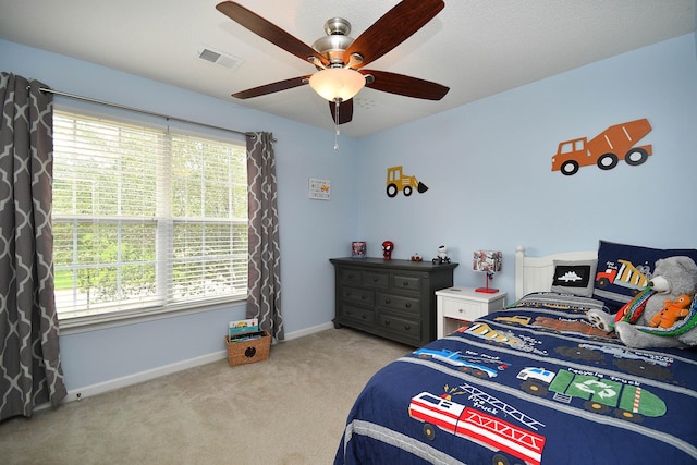 bedroom featuring carpet flooring, ceiling fan, baseboards, and visible vents