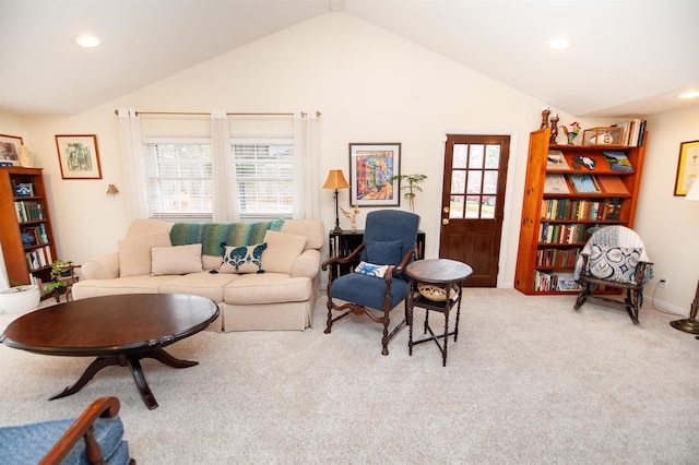 living room with a wealth of natural light, recessed lighting, carpet, and lofted ceiling