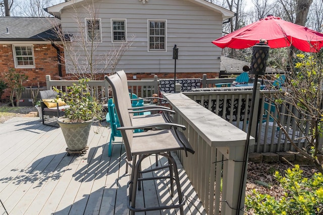 wooden terrace featuring outdoor dry bar