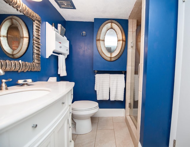 full bathroom with a shower stall, baseboards, toilet, tile patterned floors, and a textured ceiling