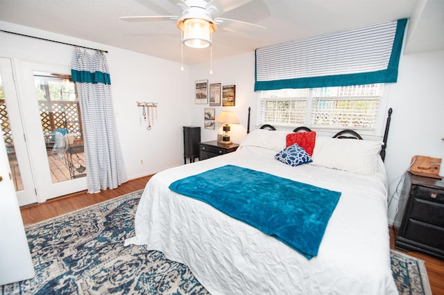 bedroom with baseboards, ceiling fan, and wood finished floors