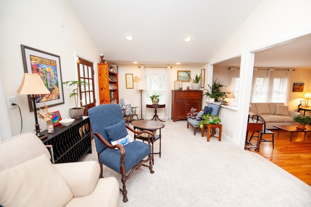 sitting room featuring recessed lighting, light wood-type flooring, a wealth of natural light, and baseboards