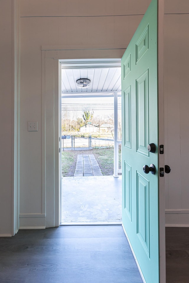 doorway to outside with wood finished floors