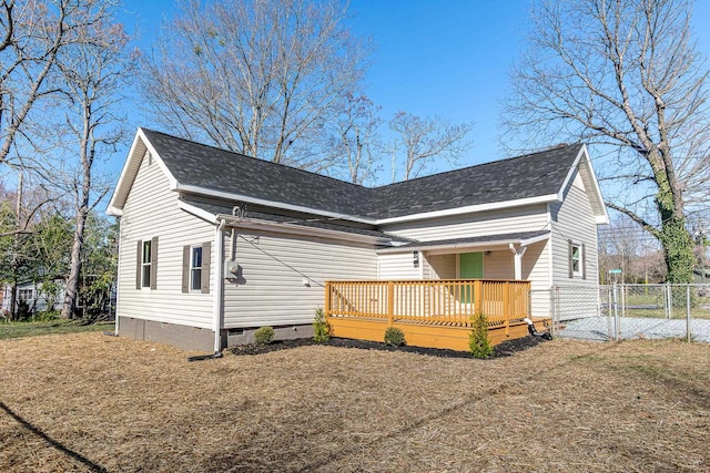 view of front of property with crawl space, a shingled roof, a deck, and a gate