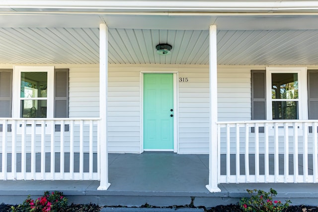 doorway to property with covered porch