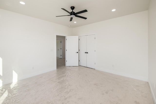 unfurnished bedroom featuring recessed lighting and baseboards