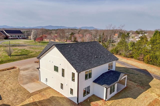 birds eye view of property with a mountain view