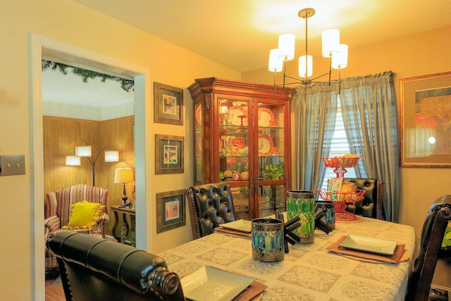 dining area with an inviting chandelier