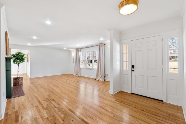 entrance foyer with light wood-style flooring, recessed lighting, and baseboards