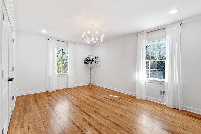 spare room with baseboards, visible vents, light wood-style flooring, recessed lighting, and a chandelier