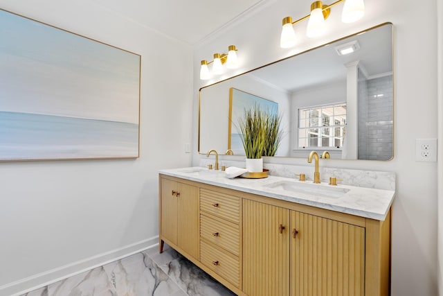 bathroom with ornamental molding, baseboards, marble finish floor, and a sink