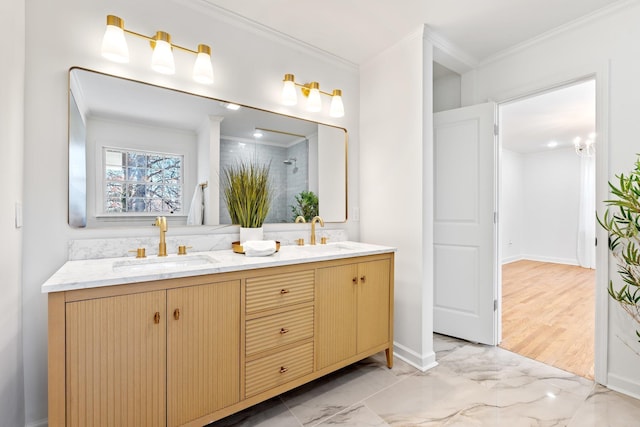 full bathroom with crown molding, double vanity, marble finish floor, and a sink