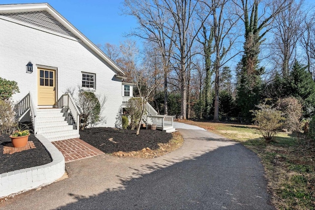 view of property exterior with brick siding