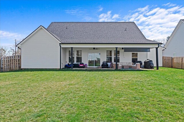 back of house featuring a patio area, an outdoor hangout area, a yard, and fence