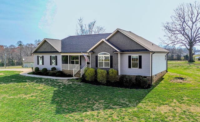 view of front of house with crawl space, roof with shingles, and a front lawn