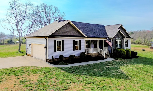 view of front of property featuring concrete driveway, a garage, covered porch, and a front yard