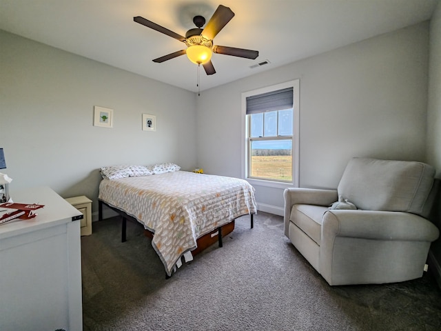 bedroom featuring visible vents, baseboards, a ceiling fan, and dark colored carpet