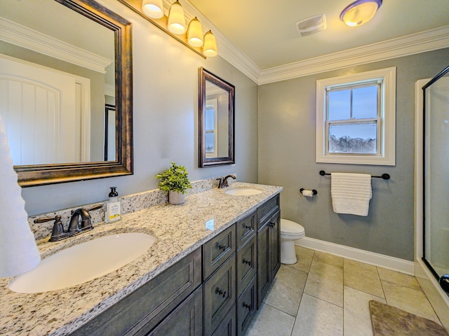 bathroom featuring a sink, baseboards, ornamental molding, and tile patterned flooring