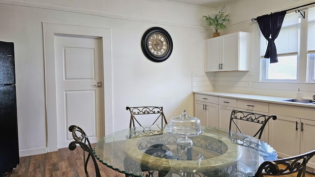dining space with dark wood-type flooring